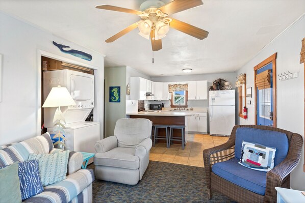 Make your way inside to the cozy Living Area with plenty of comfortable furniture and a Flat Screen TV.