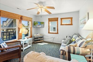 Make your way inside to the cozy Living Area with plenty of comfortable furniture and a Flat Screen TV.