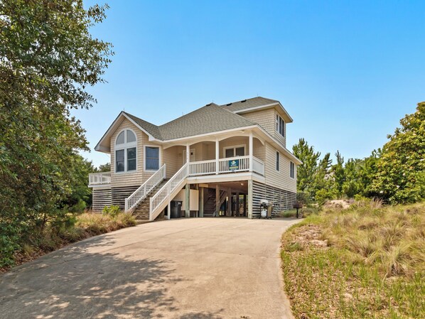 Enjoy decadently coastal relaxation at this lovely sound-side home on a large lot in a peaceful setting.