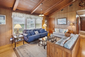 Enjoy cozy wooden paneling and a Flat Screen TV in the Living Area.