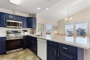 Prep a delicious meal in the Kitchen with a Breakfast Bar for additional dining spice.