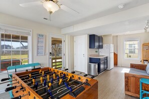 Have some fun in the Game Room with a Foosball Table and Wet Bar!