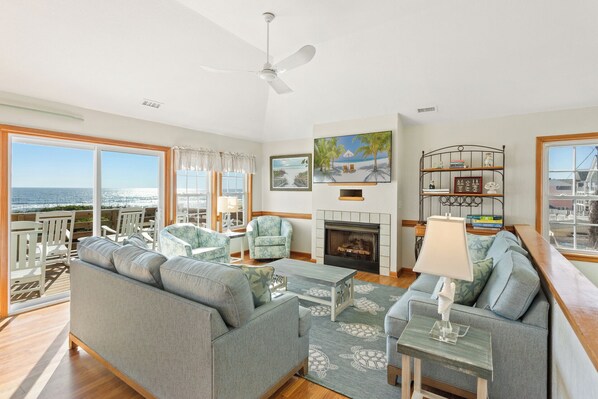 Relax around the Flat Screen TV for a fun, family movie night as you watch the moon rise up over the ocean through the sliding glass doors. (*Please Note: The fireplace is not available for guest use.)