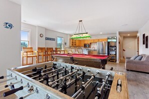 Have some fun in the expansive recreation room with a pool table, foosball table, giant Connect Four & Tic-Tac-Toe boards, 2 mounted TVs, and DVD/stereo.