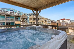 Unwind in the bubbly covered Hot Tub!