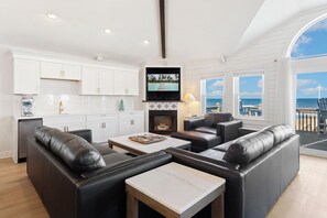 Beautifully appointed with an ocean of cozy furnishings, and a flat-screen TV with hook-ups/capabilities for iPod, video game consoles, and Netflix, the central living area is where families can unwind.