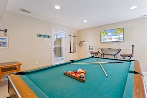 game room with pool table and T.V