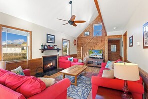 Enjoy high ceilings, cozy furniture, and a flat screen TV in the Living Area.