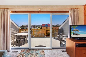 Settle in to enjoy the light filtering in through the glass sliding doors.