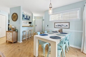 Enjoy a meal together as a family in the Dining Area with tasteful decor and access to the Screened-In Porch!