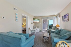 Watch your favorite shows in the beautiful Living Area with a Flat Screen TV and access right out onto the deck!