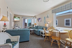 Watch your favorite shows in the beautiful Living Area with a Flat Screen TV and access right out onto the deck!