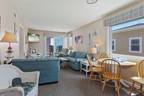 Watch your favorite shows in the beautiful Living Area with a Flat Screen TV and access right out onto the deck!