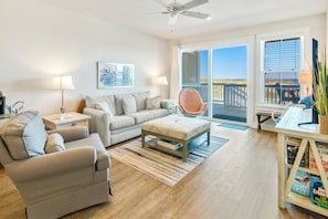 Enjoy relaxation and spectacular views of the ocean in the Living Area with lots of cozy furniture, a comfortable Papasan chair, and a Flat Screen TV.