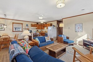 Relax in the spacious Living Area and gather around the Flat Screen TV for family movie night or a calm afternoon on TV on a rainy day.