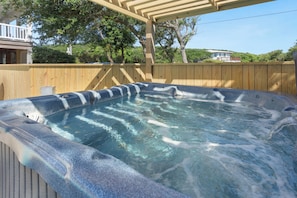 Swim a few laps in your 14'x32' private pool and then relax in the gazebo-covered hot tub.