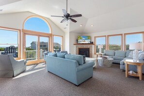 Unwind in the Living Area with vaulted ceilings and comfortable furnishings all centered around a flat-screen HDTV w/ Surround Sound System!