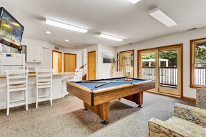 Have some fun in the Game Room with a Pool Table and Flat Screen TV!