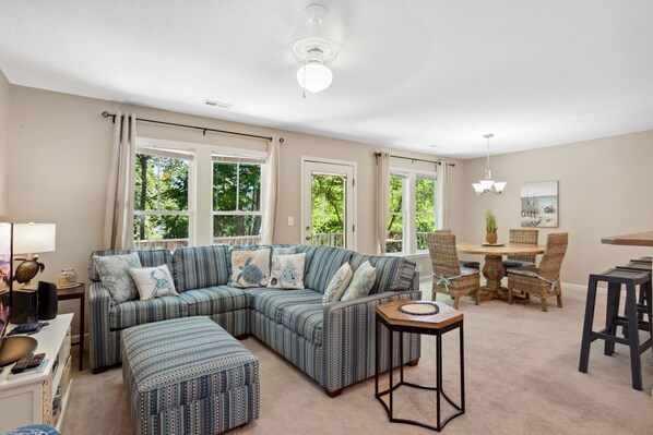 Your family will love gathering in the cozy living area that boasts comfortable furniture and plenty of natural light.