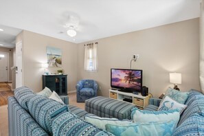 Your family will love gathering in the cozy living area that boasts comfortable furniture and plenty of natural light.