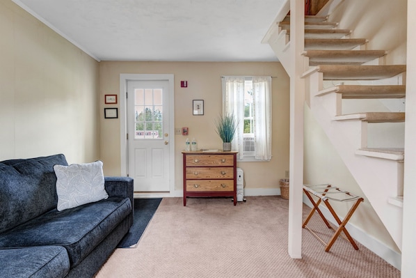 downstairs lounge area with sleeper sofa