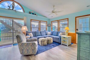 Relax in the spacious Living Area with lots of sunlight and comfortable seating.