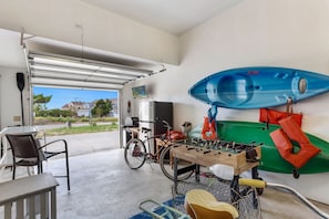 Garage with pull out grill and foosball table.