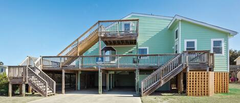 The exterior of Calm Haven provides plenty of deck space to relax and rejuvenate during your stay!
