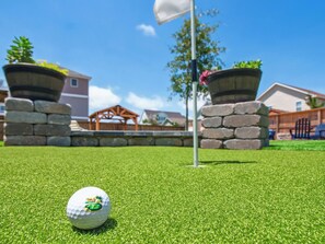 The backyard and pool area have been upgraded for the 2025 season to include a new putting green, new fire pit furniture, & more!