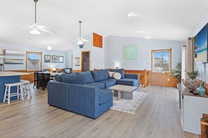 Relax in the spacious Living Area with high ceilings and beautiful interior decor.