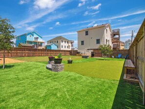 The backyard and pool area have been upgraded for the 2025 season to include a new putting green, new fire pit furniture, & more!