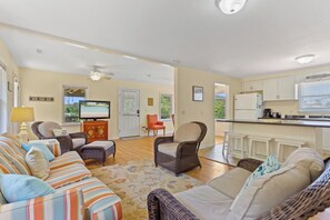 Relax in the spacious Living Area with a Flat Screen TV and lots of cozy furniture.