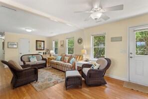 Relax in the spacious Living Area with a Flat Screen TV and lots of cozy furniture.