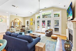 Enjoy the spacious Living Area with a variety of comfortable seating, a fireplace, and a flat-screen TV!