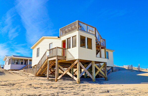 This home sits right on the beach!

*NOTE: Sand may accumulate on the beach walkway during certain parts of the year. This may make the walkway not suitable for guests with mobility issues.