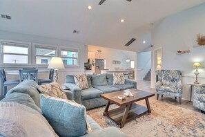 Unwind in the spacious Living Area with plenty of cozy furniture. (*Please Note: The fireplace is not for guest use.)