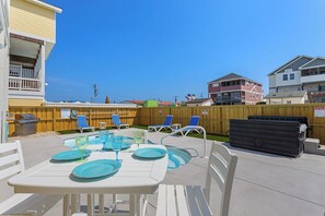 Enjoy some al fresco dining beneath the Outer Banks sunshine out back!