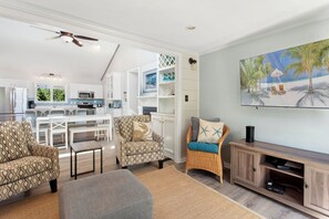 Relax in the spacious Living Area with high ceilings and tastefully modern decor.