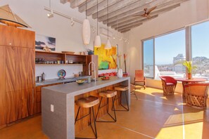 Contemporary kitchen and living spaces.