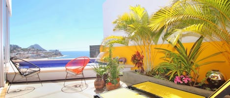 Interior courtyard and private pool with loungers and seating.