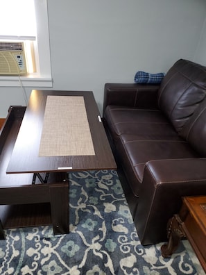 Top of coffee table lifts up for dining area
