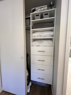 Bedroom closet with cabinetry
