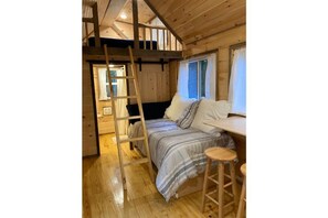 Twin bed and ladder to loft (full bed)