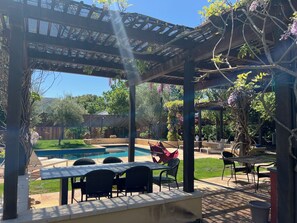 Outdoor dining table by the pool.