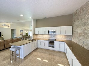 Fully stocked large kitchen with plenty of counter space and room for dancin'!