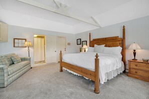 king bedroom suite with sleeper sofa and TV