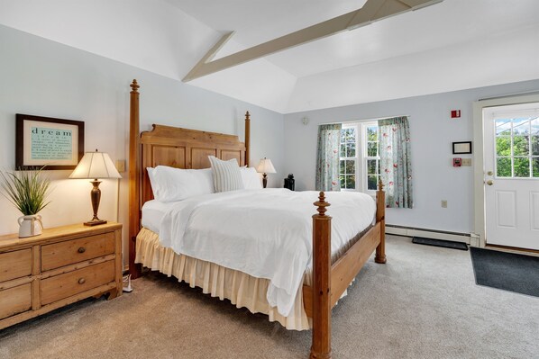king bedroom suite with sleeper sofa and TV