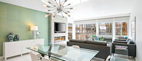 Mid Century Modern interior. Smart TVs and modern fireplace.