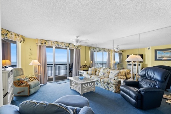 The ocean front living room is well-appointed with comfortable furnishings.