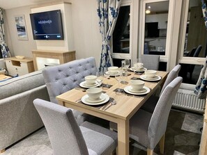 Large dining table that seats 6 persons. (Complimentary highchair available)